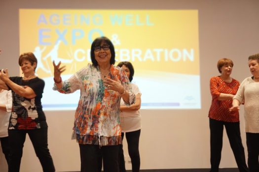 older women dancing together